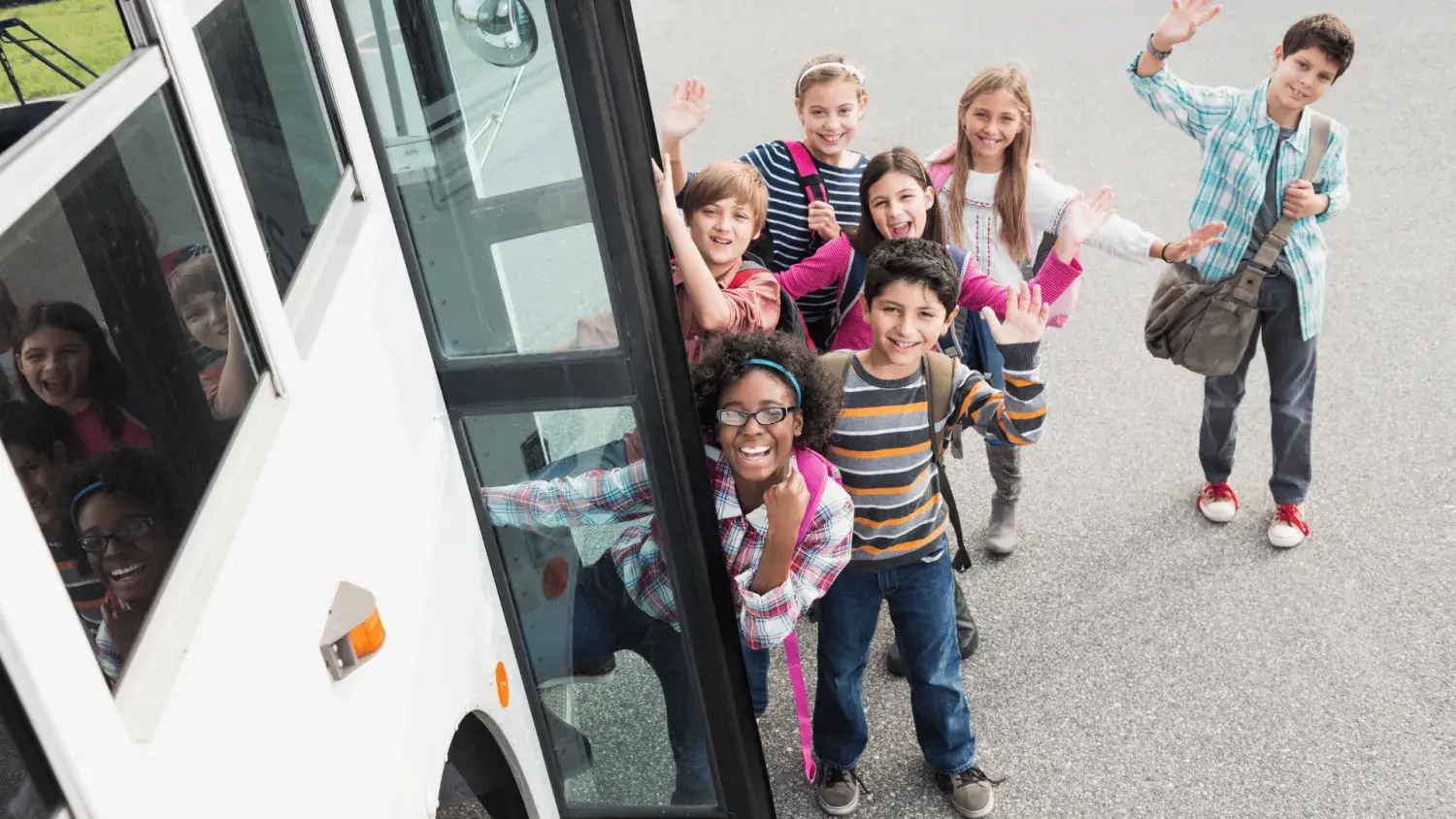 Children getting on a coach